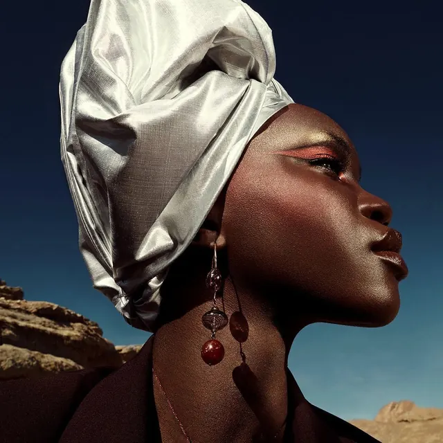 Portrait of a woman in a silk headwrap