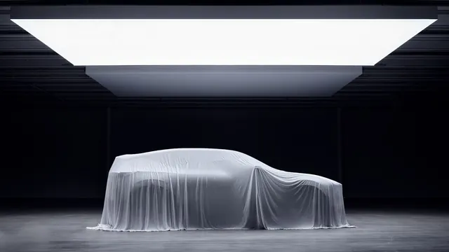 White fabric-covered car under studio light, minimal, photographic, light