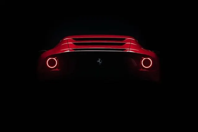 Red Car Headlights in Dark