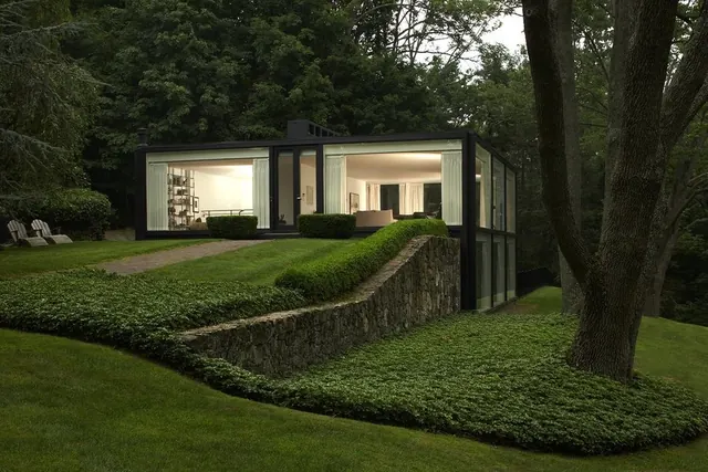 Modern glass house in forest at dusk, minimal, photographic, dark