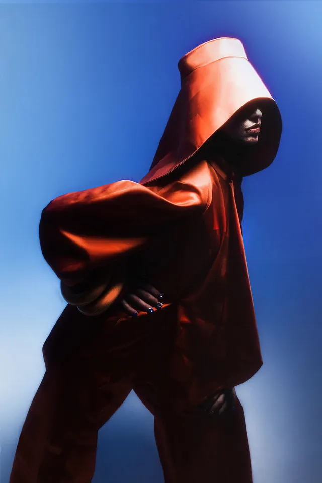 Hooded Figure in Red and Blue