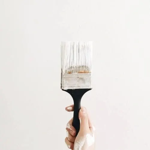 Hand Holding Paintbrush