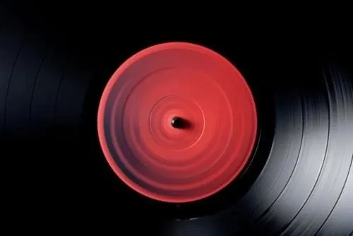 Red Vinyl Record on Turntable