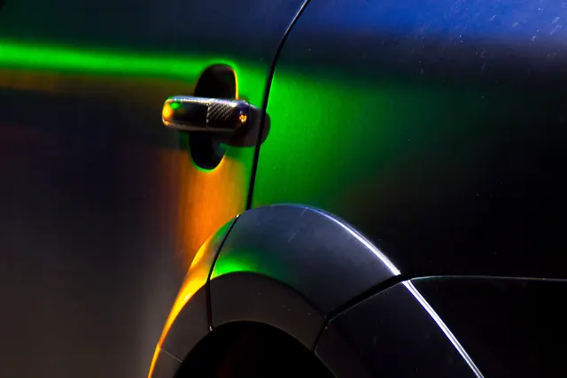 Car Body with Neon Light Reflections