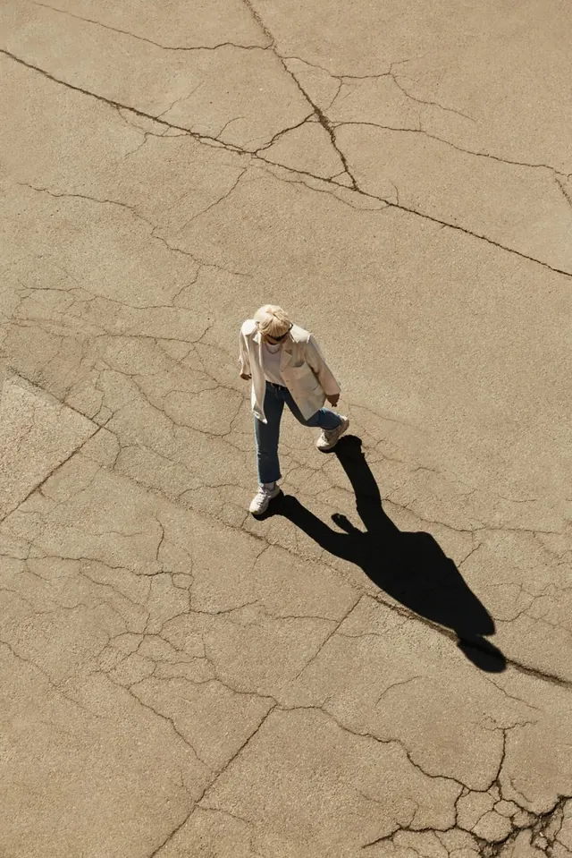 Aerial View of Person on Cracked Ground