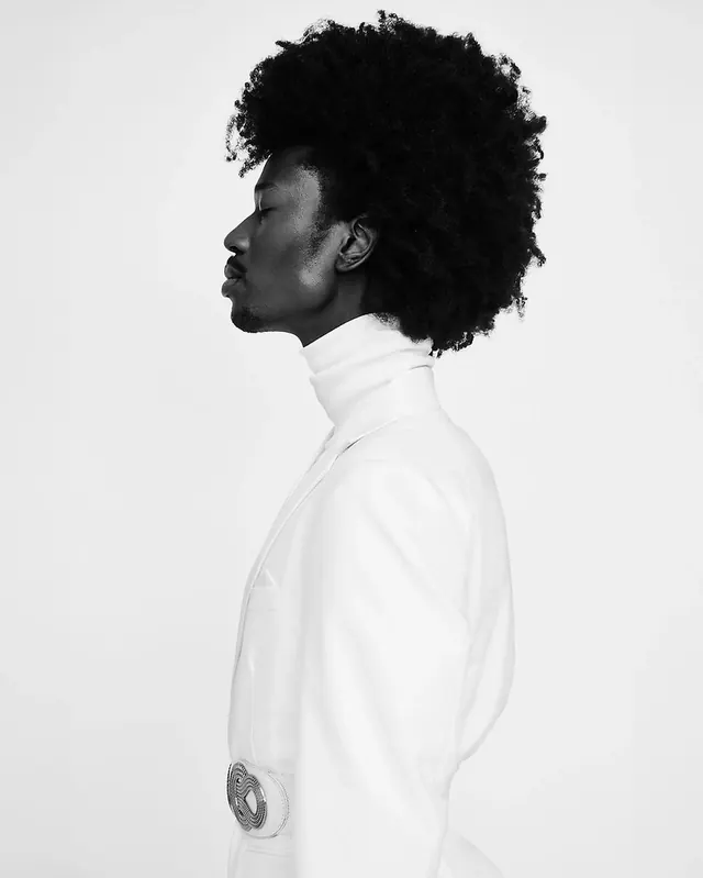 Black and White Portrait of a Person in a High-Neck Top