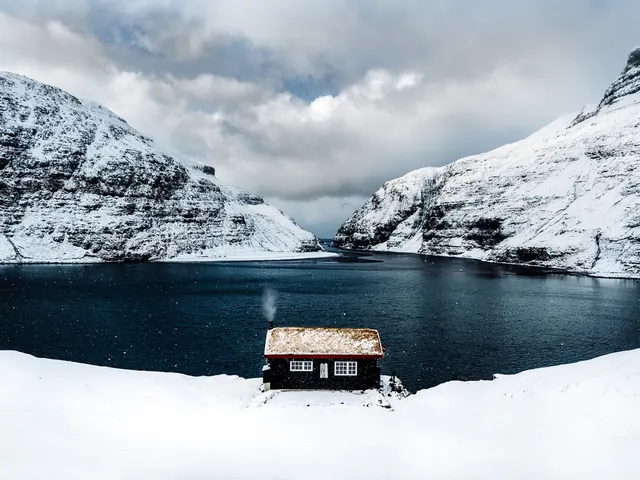 Snowy Cabin by Lake