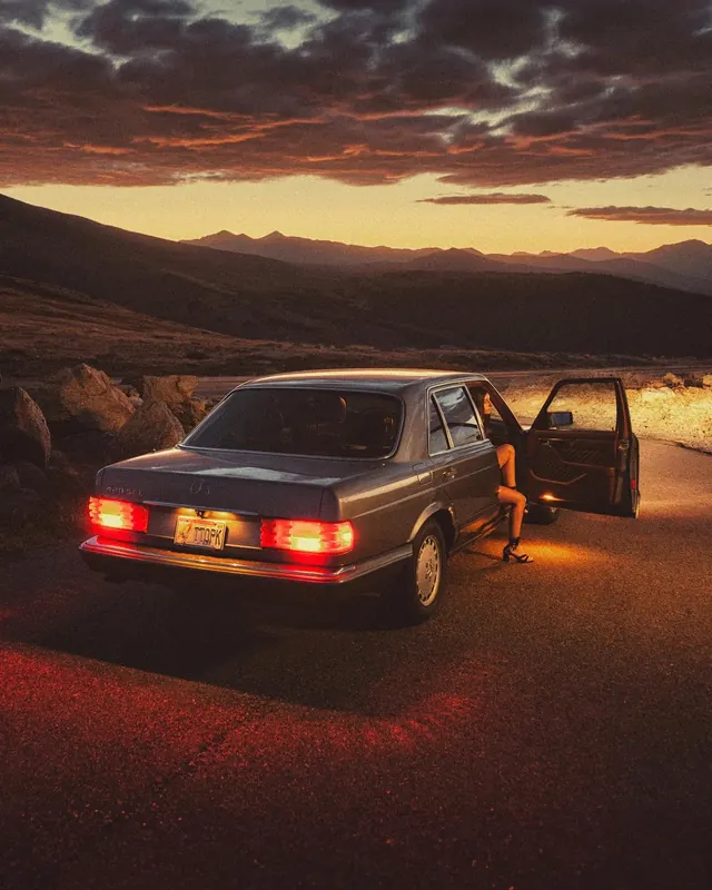SUV in Desert at Sunset