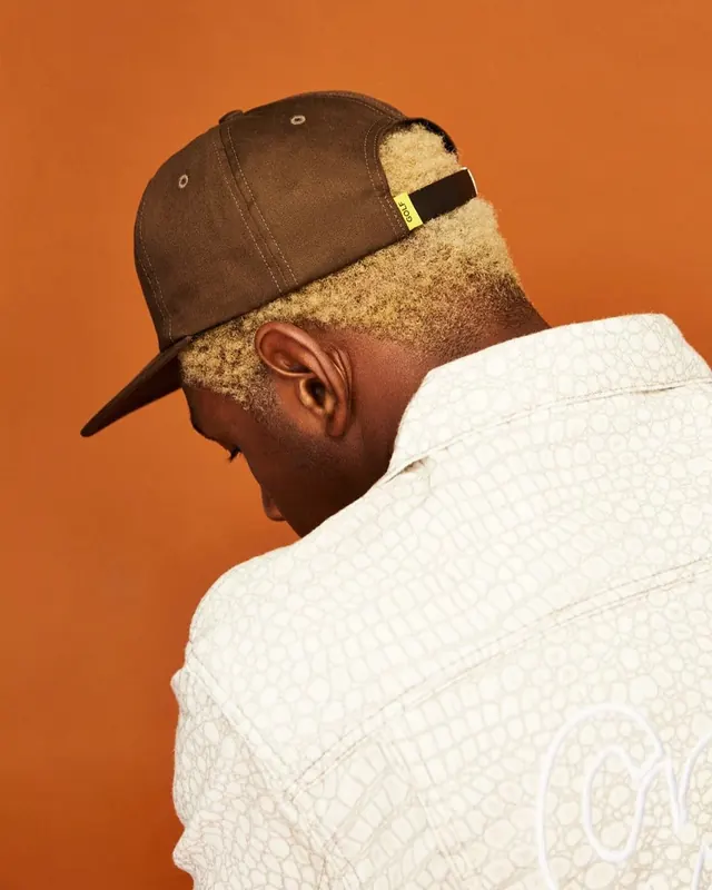 Back View Fashion Portrait with Brown Cap and Patterned Shirt, editorial, minimal, warm