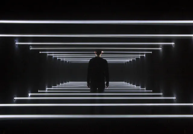 Immersive light tunnel installation, minimal, photographic, dark