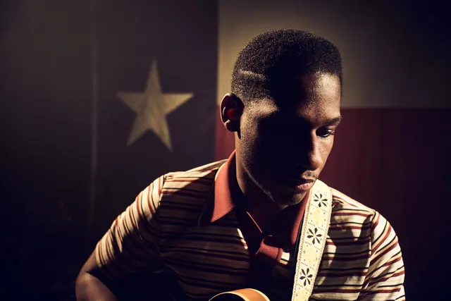 Man in Red Shirt with Star Background
