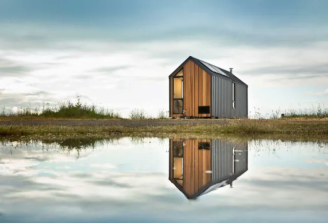 Reflective Cabin Landscape