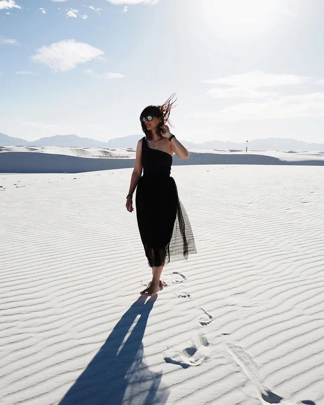 Woman in Black Dress on Salt Flat