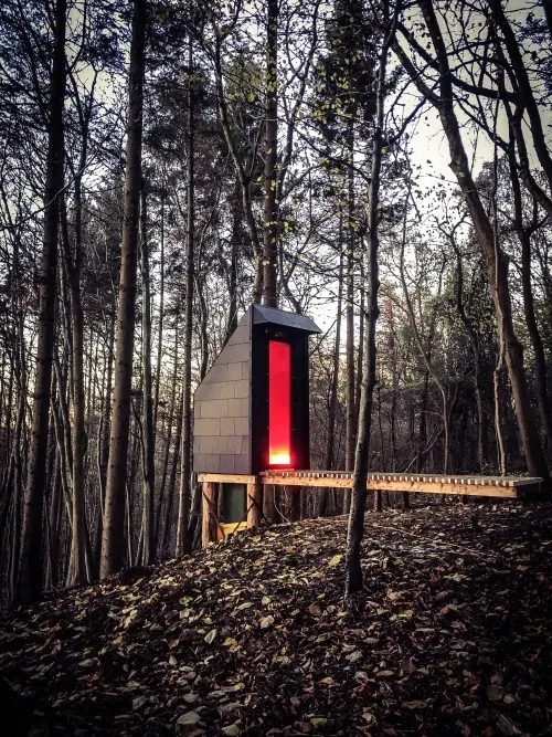 Forest Cabin with Glowing Interior
