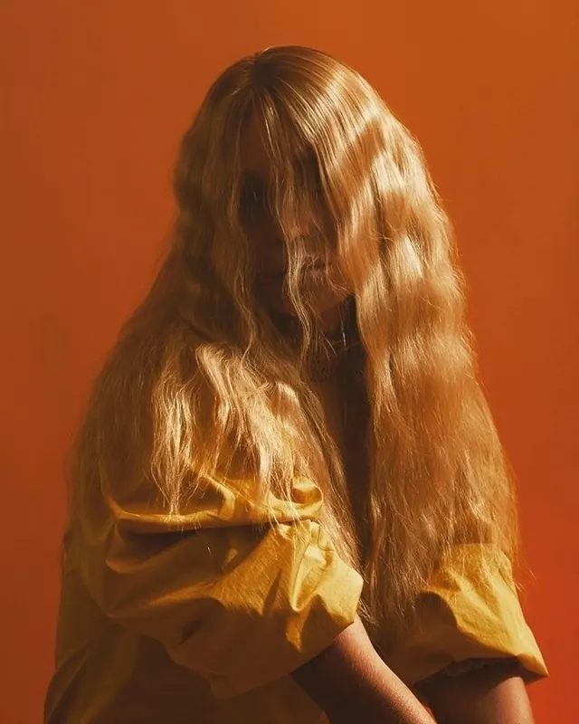 Woman with Long Hair in Orange Tones