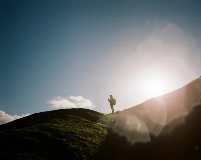 Person on Hill Silhouette