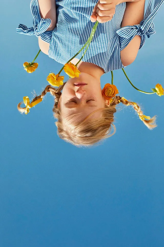 Portrait of a person with yellow flowers