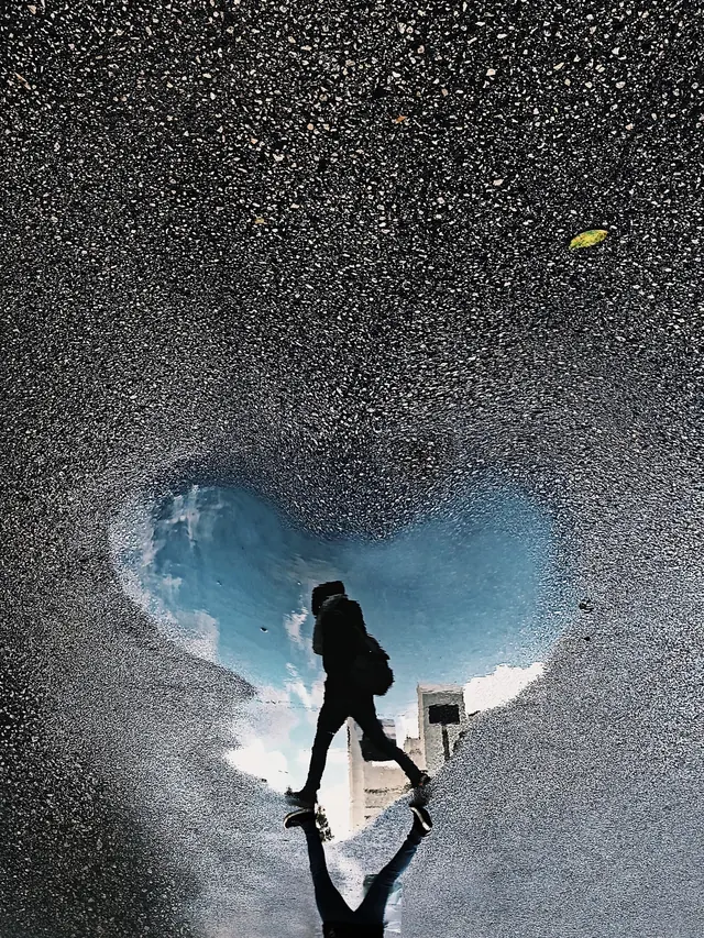 Heart-Shaped Reflection in Sand