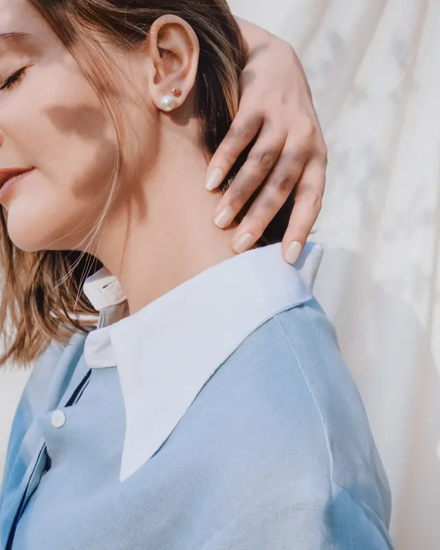 Close-up Portrait of a Woman in Blue Shirt