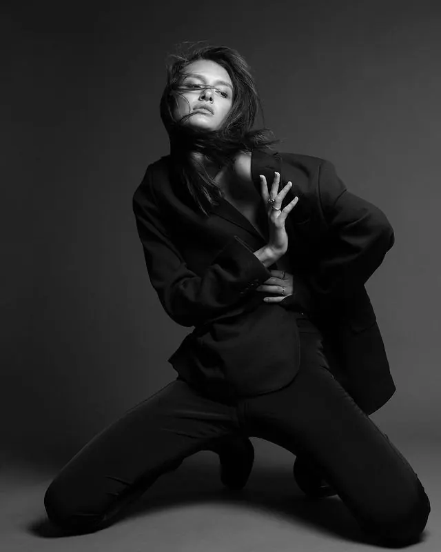 Monochrome Portrait of Person in Oversized Clothing
