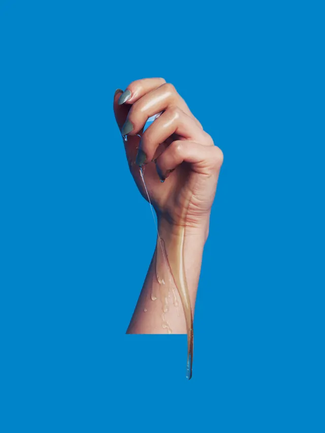 Hand Holding Needle and Thread