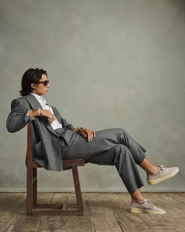 Man in Suit Seated on Chair