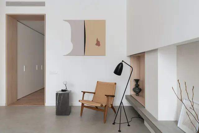 Minimalist modern interior with woven chair and abstract art, minimal, light-mode, light