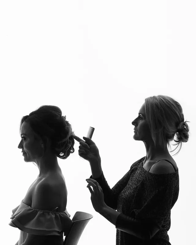 Silhouette hair styling portrait in studio, minimal, photographic, monochrome