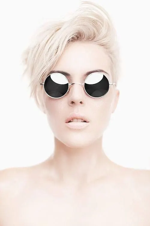 Platinum blonde woman with round sunglasses beauty portrait, minimal, photographic, light