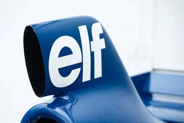 Elf logo on blue racing car body, photographic, minimal, vibrant