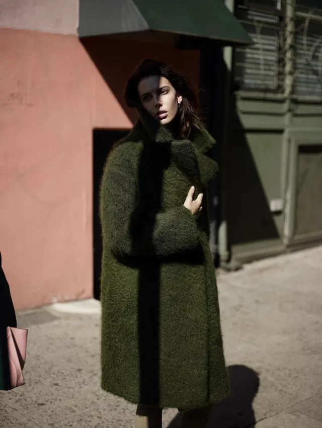 Woman in Textured Green Coat