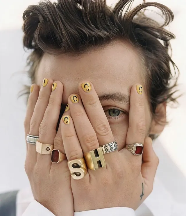 Harry Styles hands with nail art and statement rings, photographic, editorial, warm