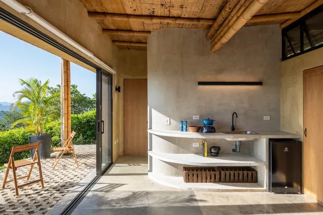 Tropical open-air modern kitchen interior, organic, minimal, warm