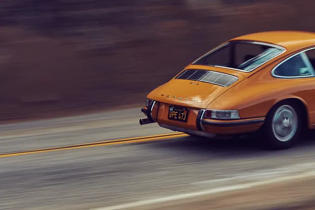 Orange Vintage Car Motion Shot