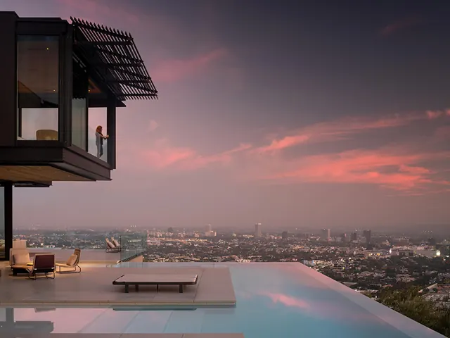 Modern hillside residence with infinity pool at dusk, minimal, photographic, muted