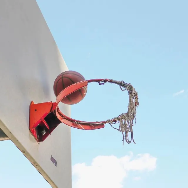 Red Industrial Hardware on White Surface