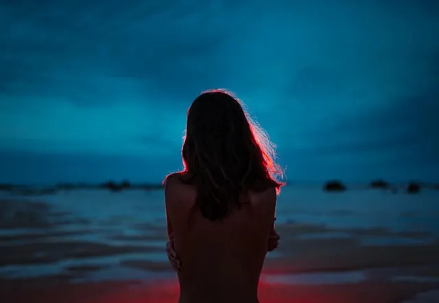 Woman on Beach at Twilight