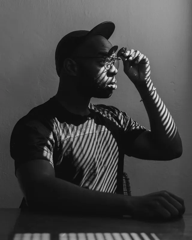 Monochrome Portrait of Man in Cap