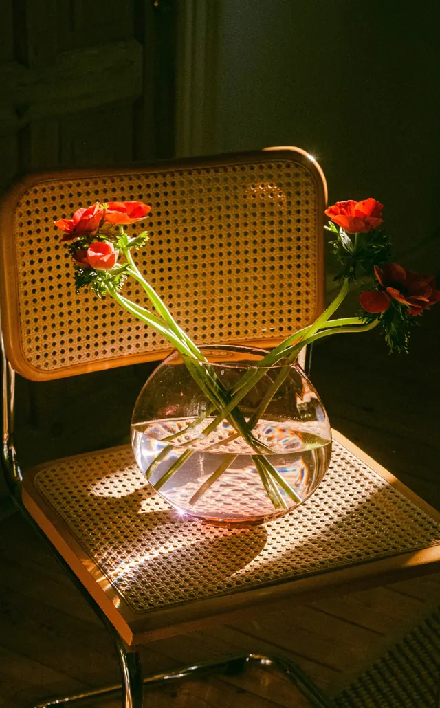 Woven Chair with Floral Arrangement