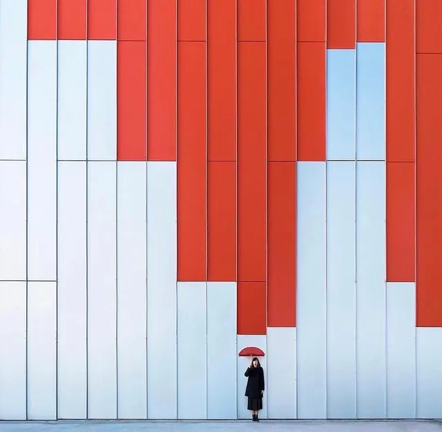 Red Geometric Wall with Umbrella Figure, minimal, geometric, high-contrast
