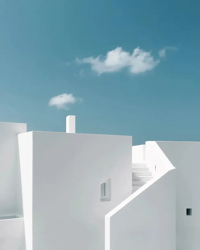 Cycladic white architecture against blue sky, minimal, photographic, light