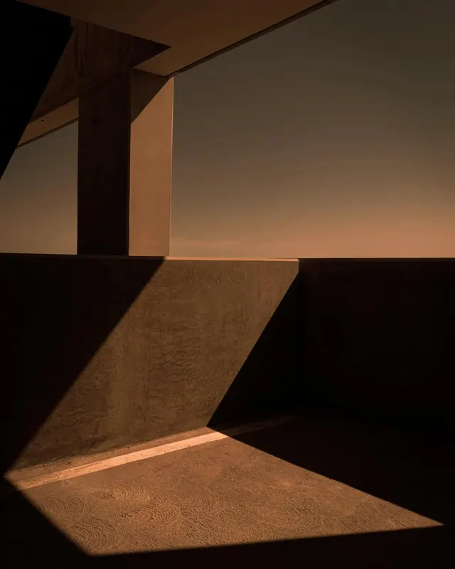 Golden-hour brutalist balcony shadows, brutalist, minimal, warm