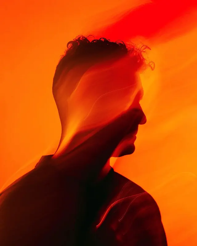 Light-painted orange profile portrait, photographic, abstract, warm