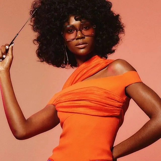 Portrait of a woman in orange attire