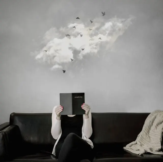 Person Reading Book with Cloud Illustration