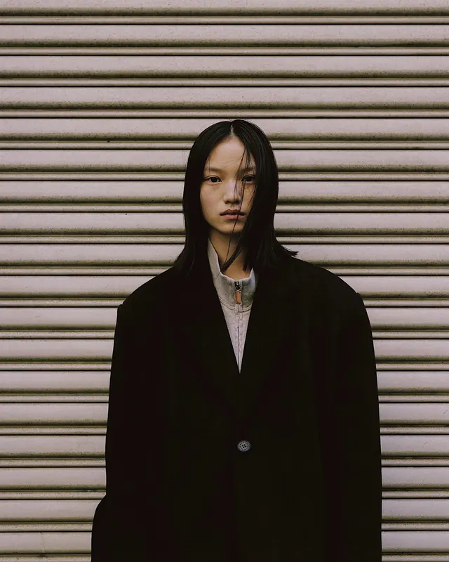 Portrait of a woman in a black coat