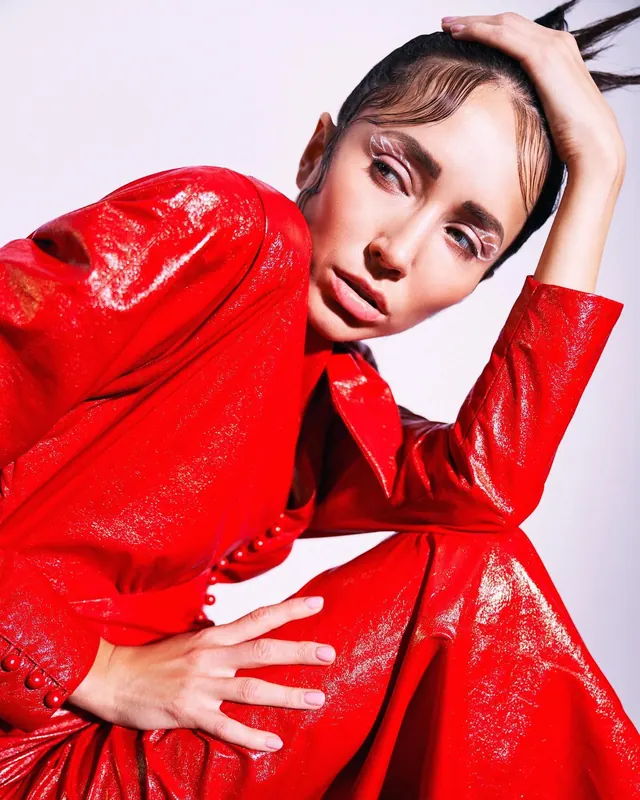 Red lacquer editorial beauty portrait, editorial, photographic, vibrant