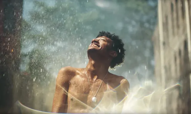 Water spray joy portrait, photographic, organic, warm