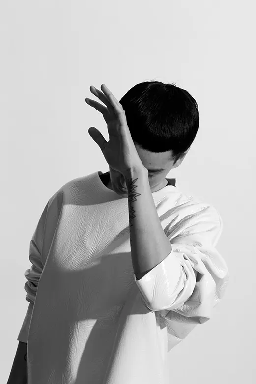 Crinkled white fashion portrait, editorial, photographic, monochrome