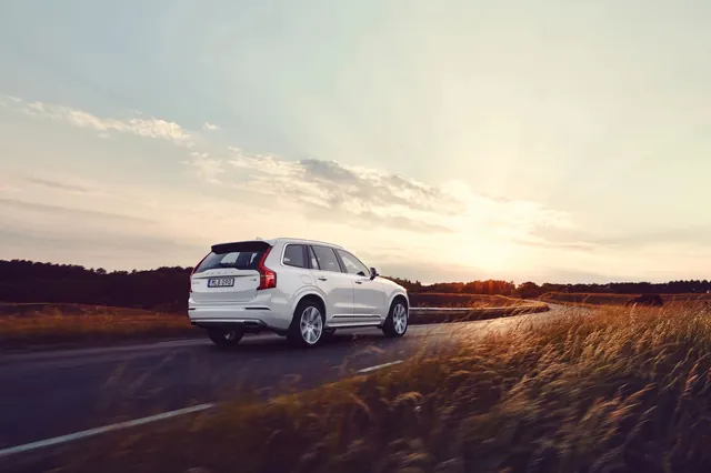 Car Driving at Sunset
